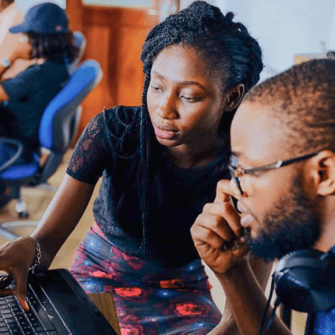 man and woman looking at a computer screen
